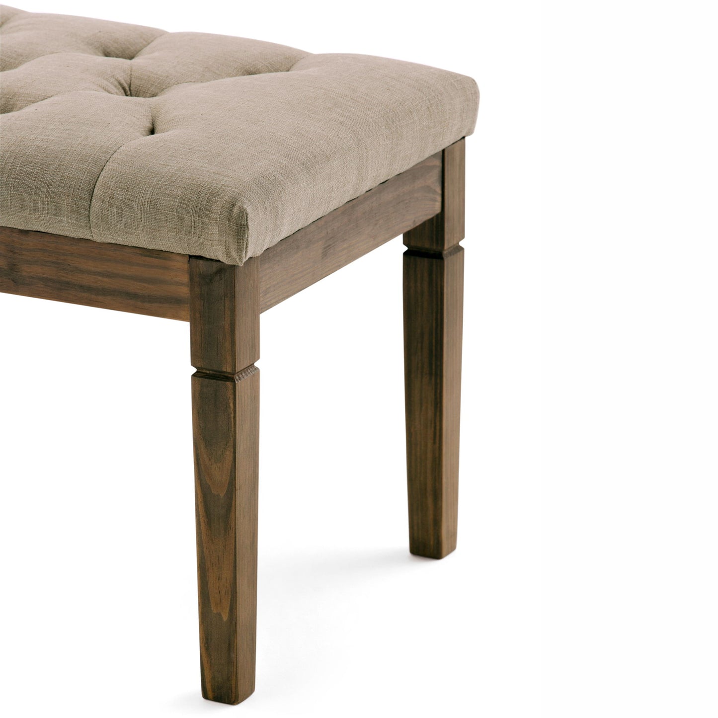 A close-up of the Waverly - Upholstered Tufted Ottoman Bench featuring a beige, tufted cushion and square wooden legs against a plain white background.
