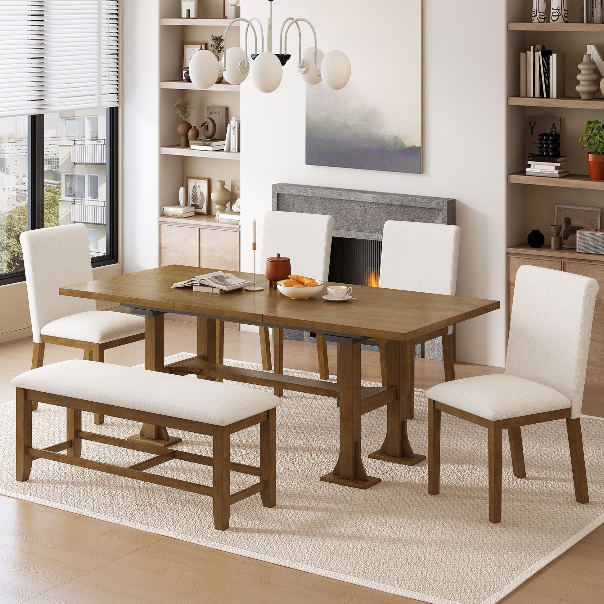 A modern dining room features the Topmax 6 Piece Farmhouse Extendable Dining Table Set with a trestle table, removable leaf, upholstered chairs and bench on a light rug, surrounded by shelves, artwork, décor, and large windows letting in natural light.