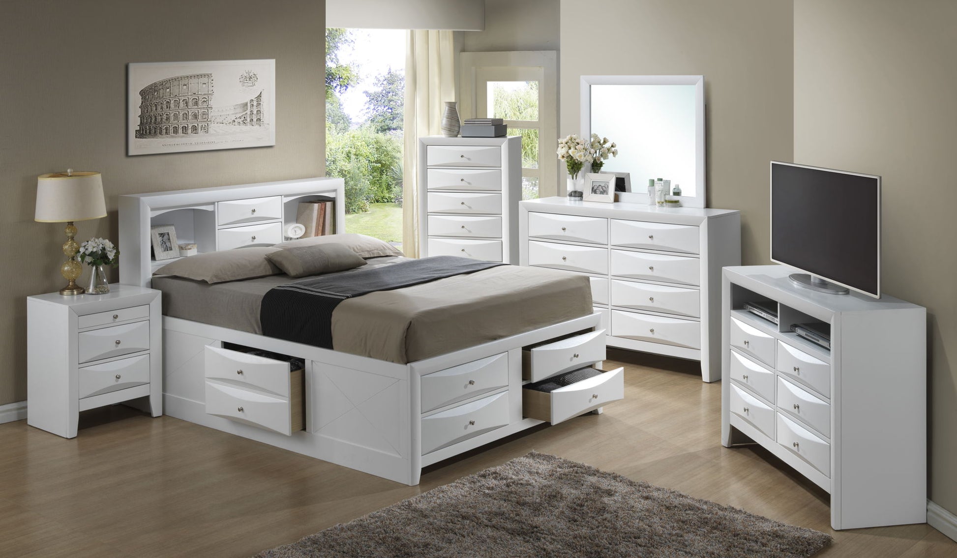 A modern bedroom with white furniture, featuring the Marilla Storage Bed with Bookcase Headboard, nightstands, tall chest, dresser with mirror, TV stand, lamp, wall art, and wood flooring illuminated by natural window light.