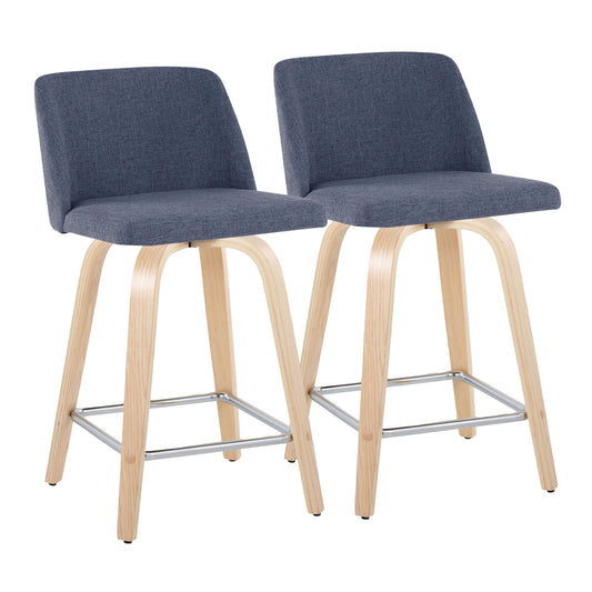 Two Toriano contemporary fixed-height counter stools feature cushioned blue-gray fabric seats and backs, light wooden legs, and square metal footrests, set against a plain white background.