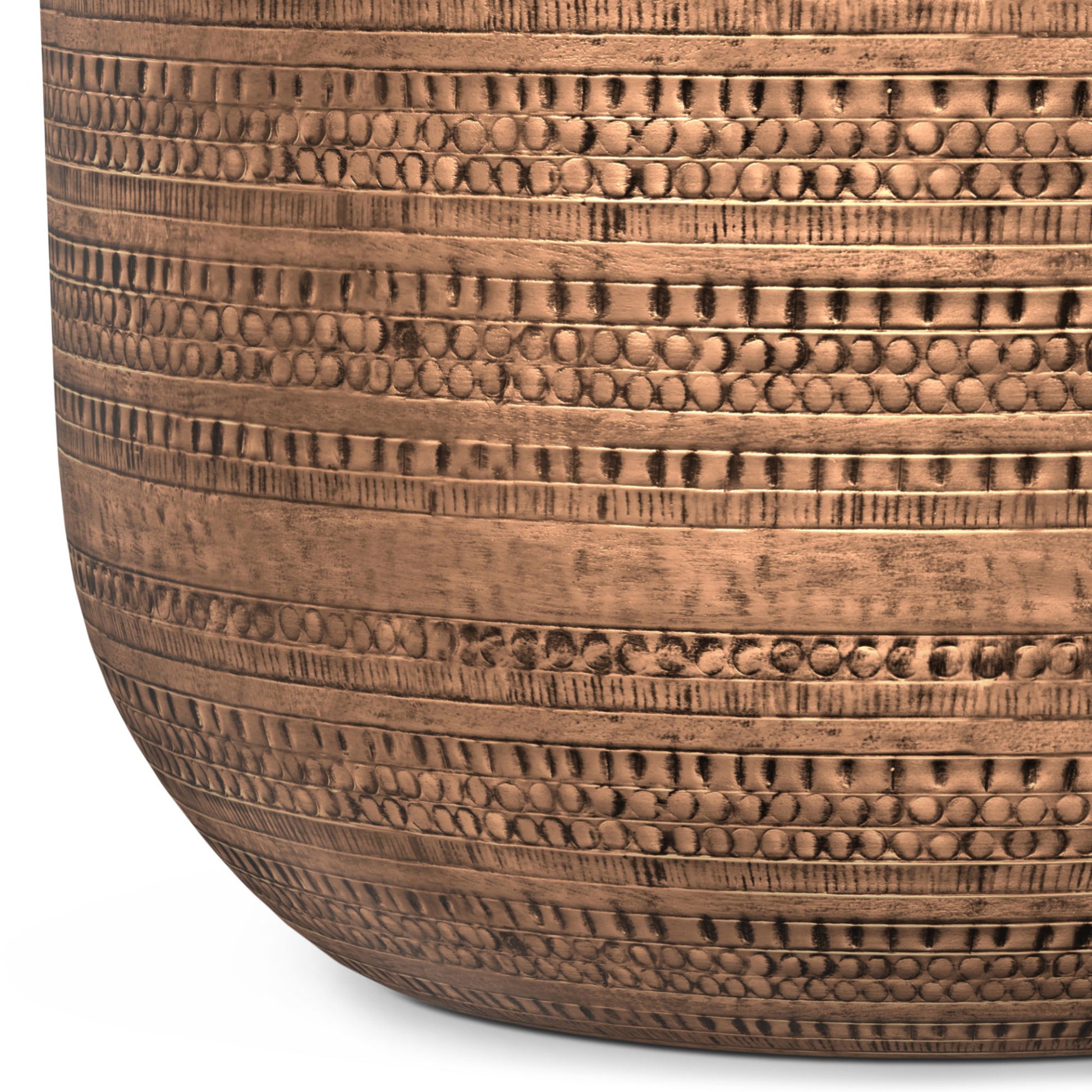 Close-up of the Johnsen Handcrafted Metal Coffee Table, featuring a round, bronze-colored design with horizontal textured and dotted embossed patterns, displayed against a white background.