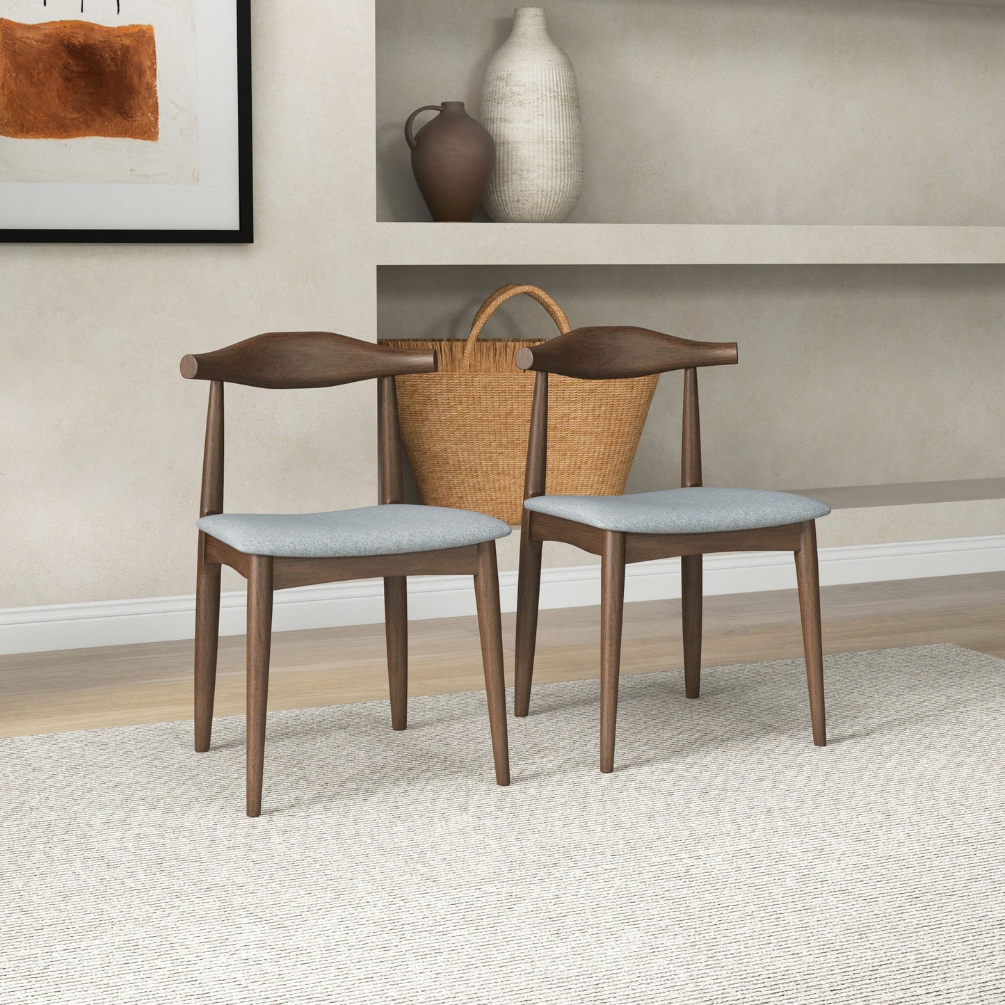 The Destiny - Modern Dining Chairs (Set of 2) with light gray seats are arranged on a textured beige rug, complemented by a large woven basket and decorative vases displayed on shelves against a light wall.