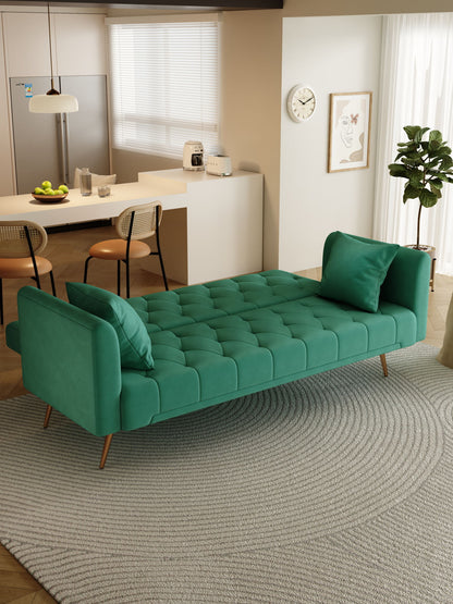 Contemporary living area featuring a Convertible Double Folding Living Room Sofa Bed with matching pillows on a round textured rug. The space includes a kitchen counter with stools, fruit bowl, appliances, and large windows for natural light.