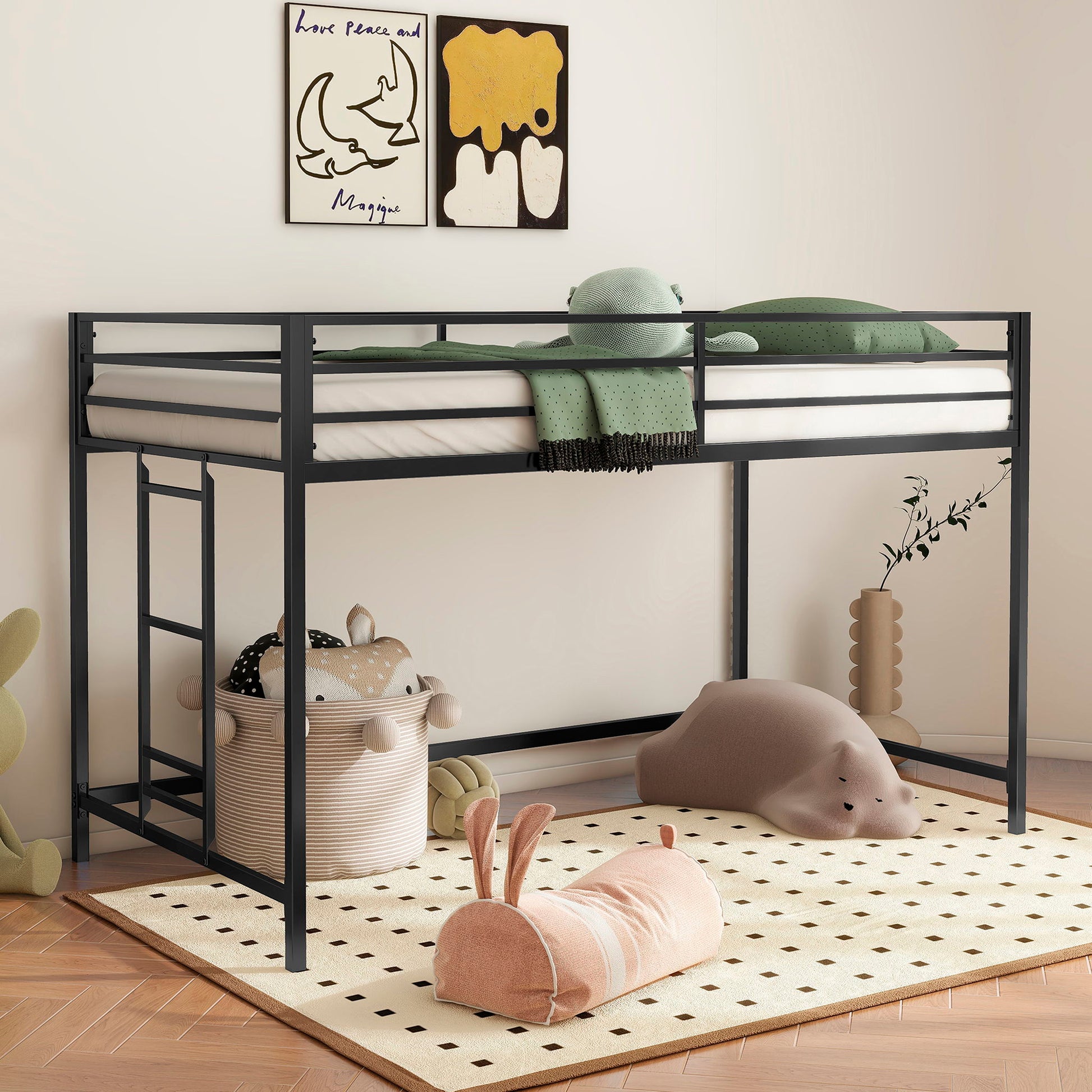 The Adam - Junior Twin Loft Bunk in black features green bedding and is set above a play area with animal toys, baskets, a dotted rug, playful wall art, and vine-shaped decor.