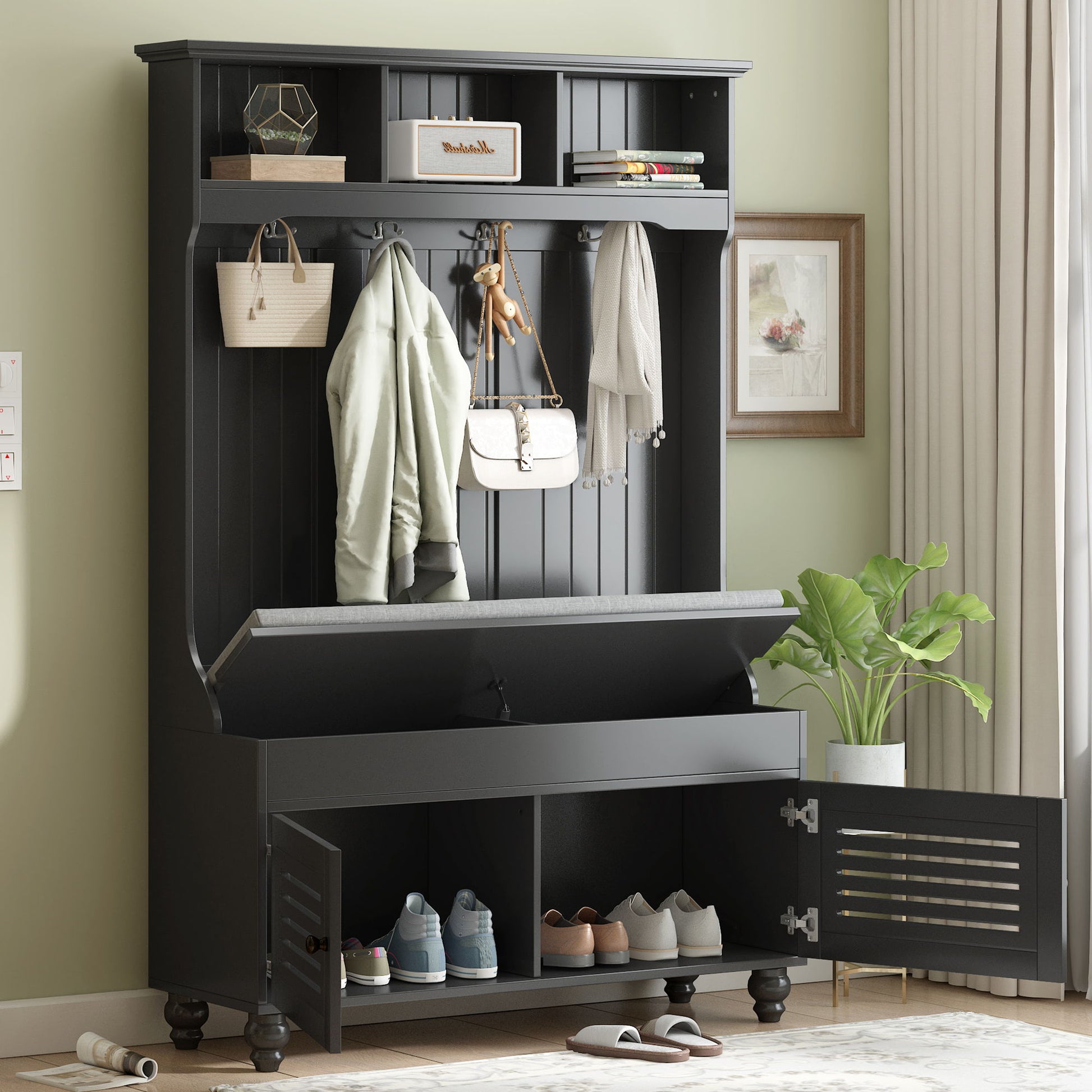 A 5 in 1 entryway bench with shutter-shaped doors, coat rack, cushioned seat, and 4 sturdy hooks offers open storage and bottom cubbies for shoes. Nearby are a potted plant and framed artwork. Perfect for hallway or living room organization.