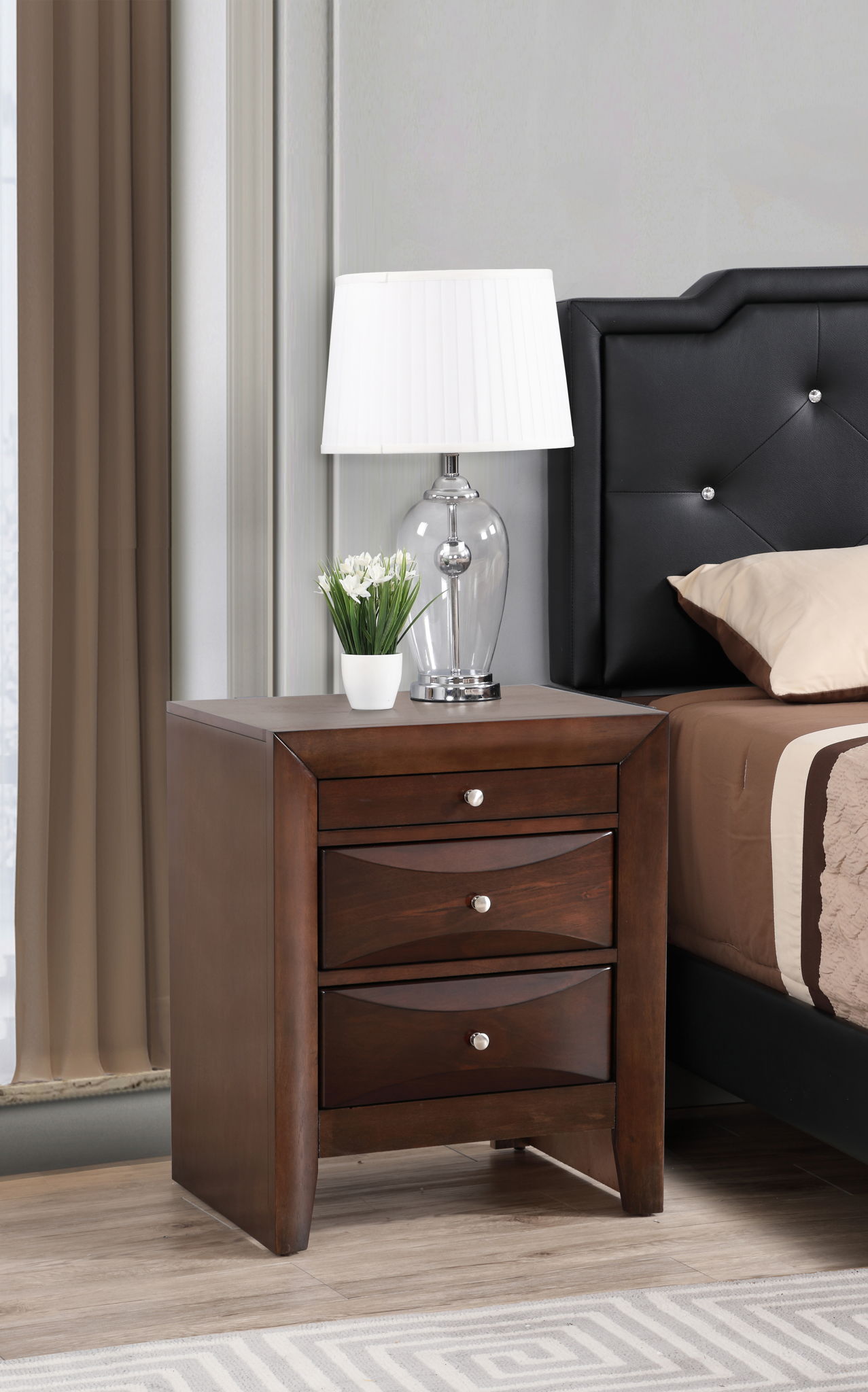 A lamp placed on the Marilla Nightstand.