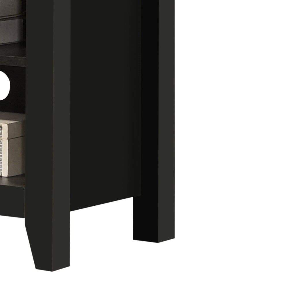 A close-up of the Benito TV Stand shows its black wooden finish, open lower shelf with books, and a round cable management hole on the back panel.