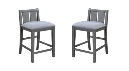 The Graham 3 Piece Small Space Counter Height Dining Set features two gray wooden chairs with light gray upholstered seats and slatted backs, shown on a white background.