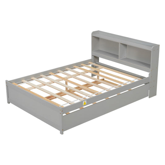 A gray wooden Full Bed with Trundle and Bookcase features a slatted base and a headboard with two open storage shelves. Shown without mattress.