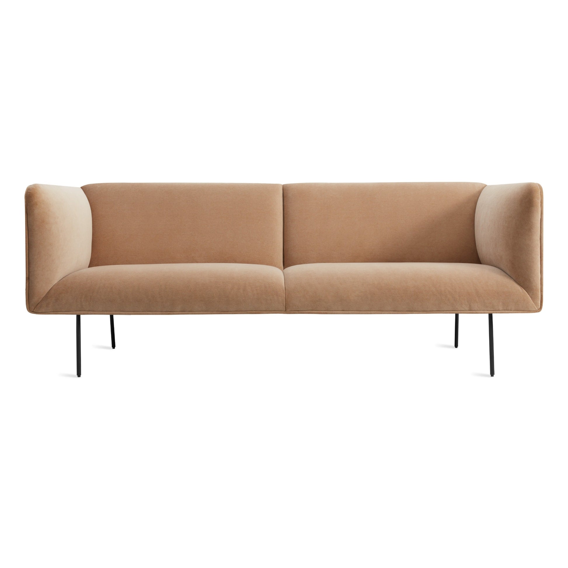 The Dandy Velvet Sofa in camel velvet features a modern, minimalist design with straight arms, cushioned seats, and thin black metal legs, set against a white background.