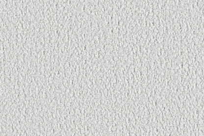 Close-up of the Dori Sofa by Acanva, showcasing its textured white fabric, featuring a rough, irregular pattern with small shadows creating a dappled effect. The surface appears slightly grainy, giving it a tactile, rustic appearance.