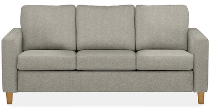 A front view of the Berin Day & Night Sleeper Sofa, featuring a light gray upholstery, modern design, and wooden legs for a sleek three-seater sofa.