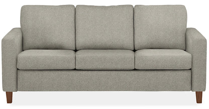 The Berin Day & Night Sleeper Sofa is a gray, modern three-cushion sofa featuring wooden legs.