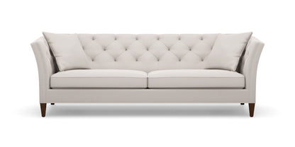 The Shelton 98" Sofa features a light gray, tufted back design with two square cushions. It showcases clean lines and tapered wooden legs, offering a modern and elegant aesthetic against a white background.