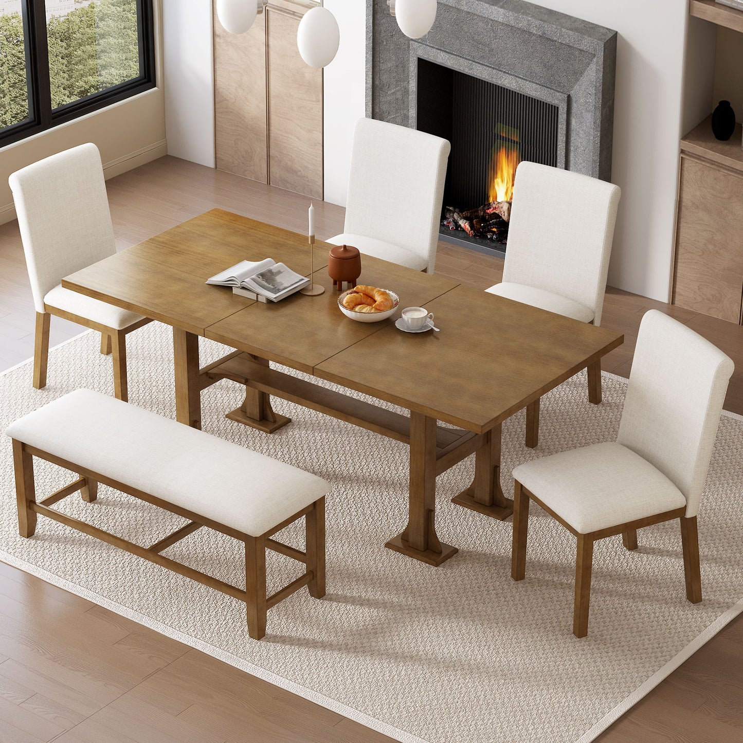 The Topmax 6 Piece Farmhouse Extendable Dining Table Set, featuring a trestle table with removable leaf, upholstered chairs and bench, is arranged on a light rug in a modern room by a fireplace and large window with cups, teapot, plates, and pastries.