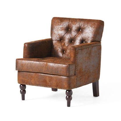 The Vitality Club Chair features brown leather upholstery, button tufted diamond stitching, nailhead trim, and dark turned wooden legs, displayed against a plain white background.