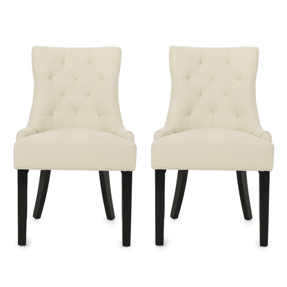 A set of two Cheney Contemporary Dining Chairs with cream tufted upholstery and black wooden legs, placed side by side against a white background.
