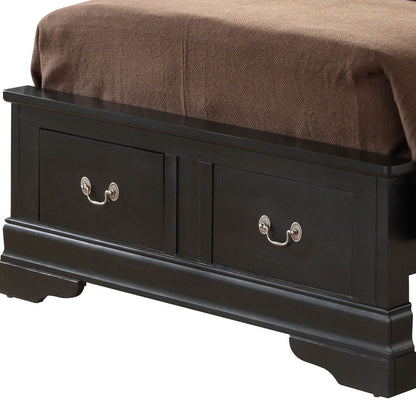 A close-up of the Louis Phillipe - Storage Bed’s dark wooden footboard with two drawers and silver handles, topped with a brown blanket.