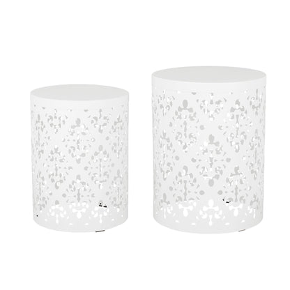 Set of two white Outdoor Metal Modern Design End Tables, each featuring intricate cut-out patterns. One table is taller and wider, the other shorter and narrower; both have solid tops and sturdy bases.