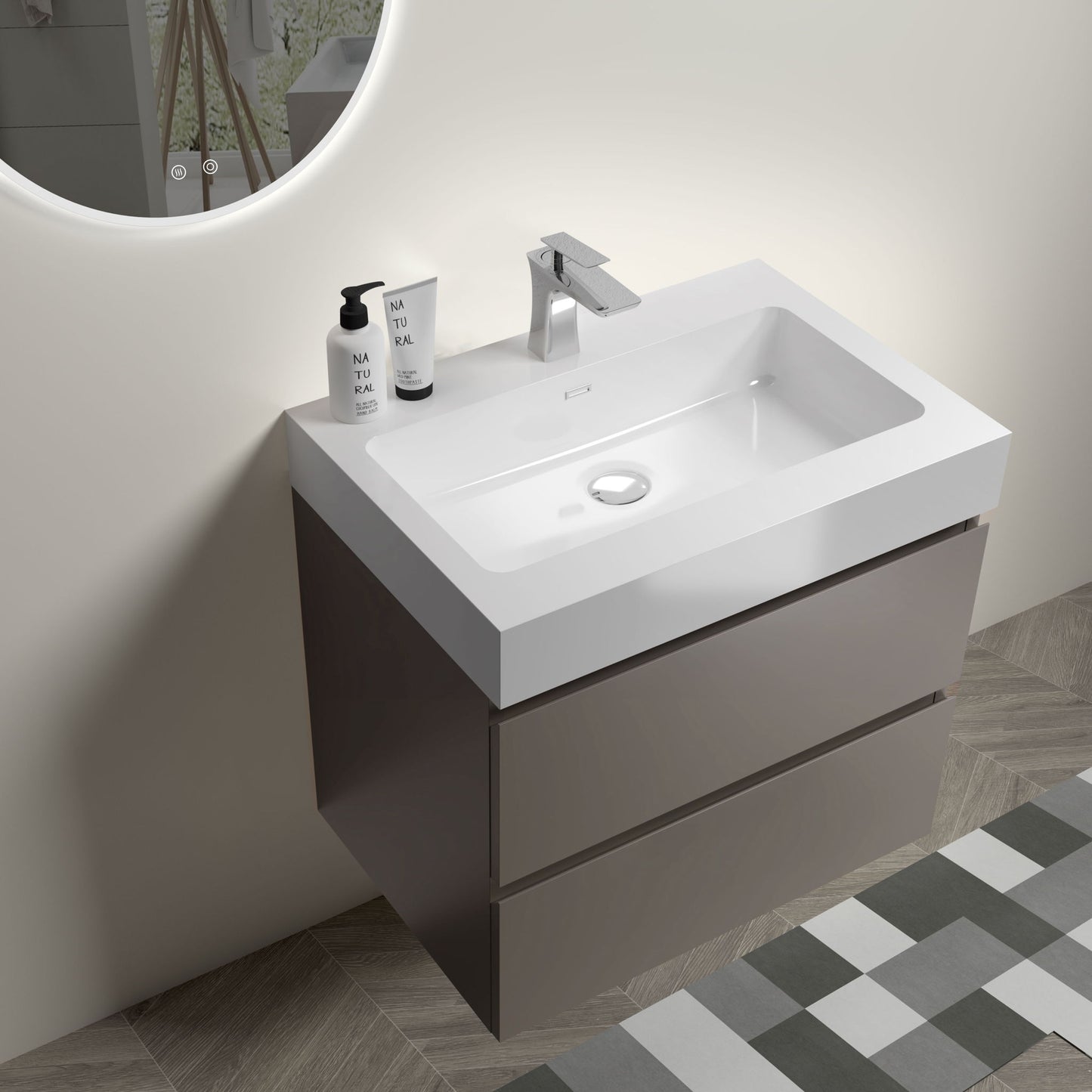 The Alice Bathroom Vanity features a rectangular white one-piece sink basin (no drain or faucet), large wall-mounted storage, and two brown drawers. It’s set against pale walls with chevron floor tiles; topped with a soap dispenser and container.