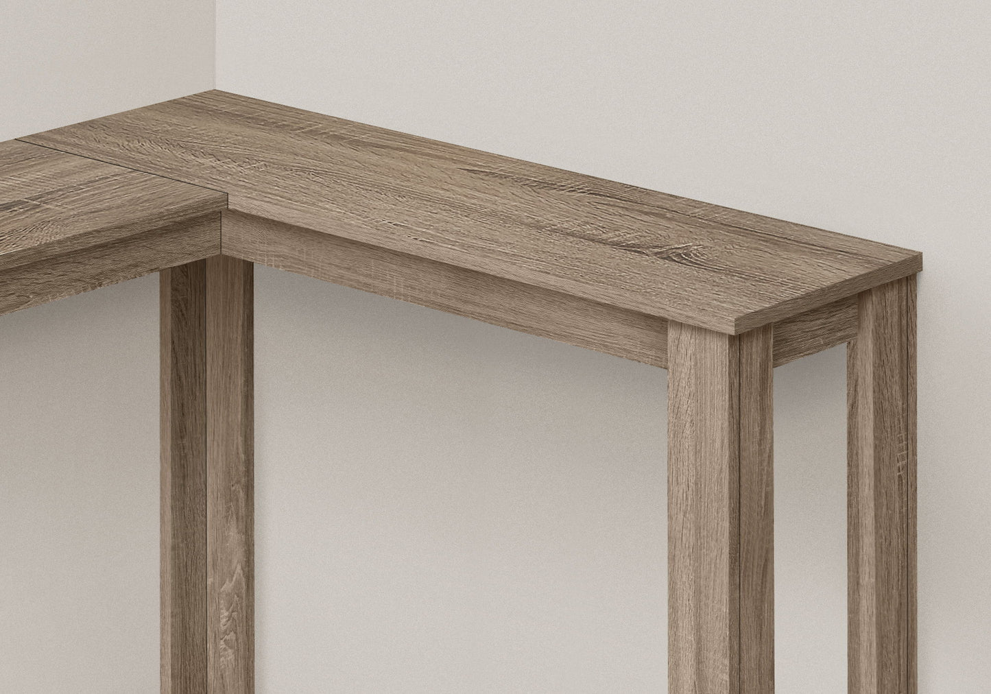 The Corner Accent Console Table for Entryway features a unique contemporary design with clean lines and sturdy legs, finished in natural wood and perfectly suited for placement in a corner against a white wall.