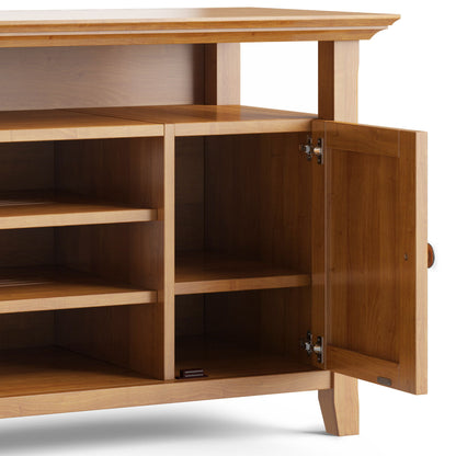 The Amherst - TV Media Stand, Handcrafted, features a natural wood finish, four shelves, an open right door revealing empty storage space inside, and stands on simple, sturdy legs.