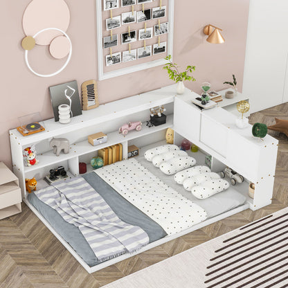 A cozy bedroom features the Floor Bed With L-Shaped Bookcases, Sliding Doors, Without Slats, styled with polka-dot pillows and a striped blanket. Pastel art, a photo collage, plants, and wooden flooring complete the warm look.