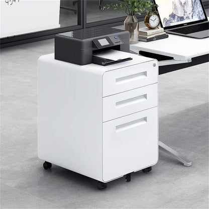 A black printer sits on a 3 Drawer Mobile File Cabinet Under Desk Office, featuring a 5-wheel design and cold rolled steel build, in a modern office near a desk with a laptop and plant.