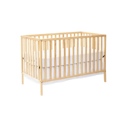 The Palmer - 3-in-1 Convertible Island Crib features vertical slats on all sides and includes a white mattress, shown against a plain white background.