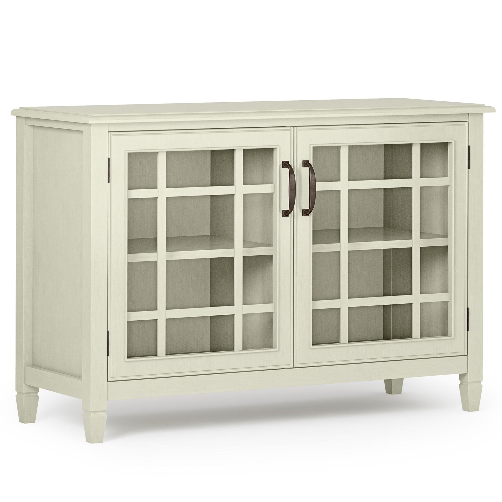 The Connaught - Handcrafted Low Storage Cabinet features a light wood finish, two glass-paned doors with a grid design, dark metal handles, interior shelving, and stands on four short legs.