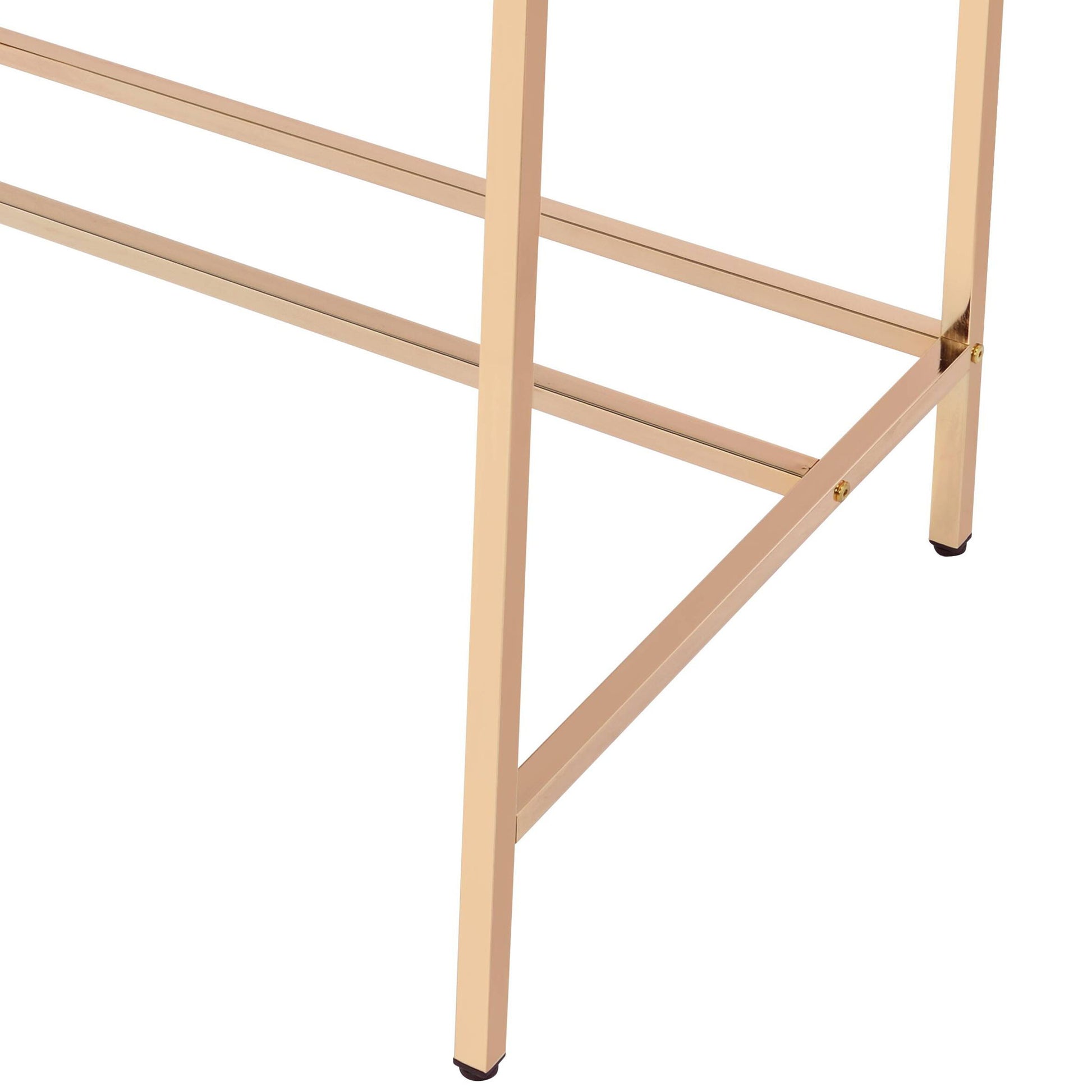 Close-up of the lower part of the Midriaks - Writing Desk With USB’s metallic gold frame, showing angled legs, crossbars, and small black caps on the feet.