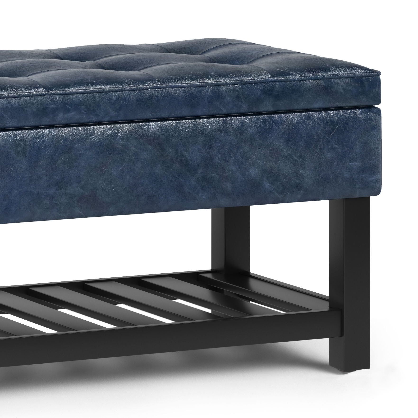 The Cosmopolitan - Storage Ottoman Bench With Open Bottom is a blue tufted leather bench with a cushioned seat, black wooden frame, and a slatted lower shelf.