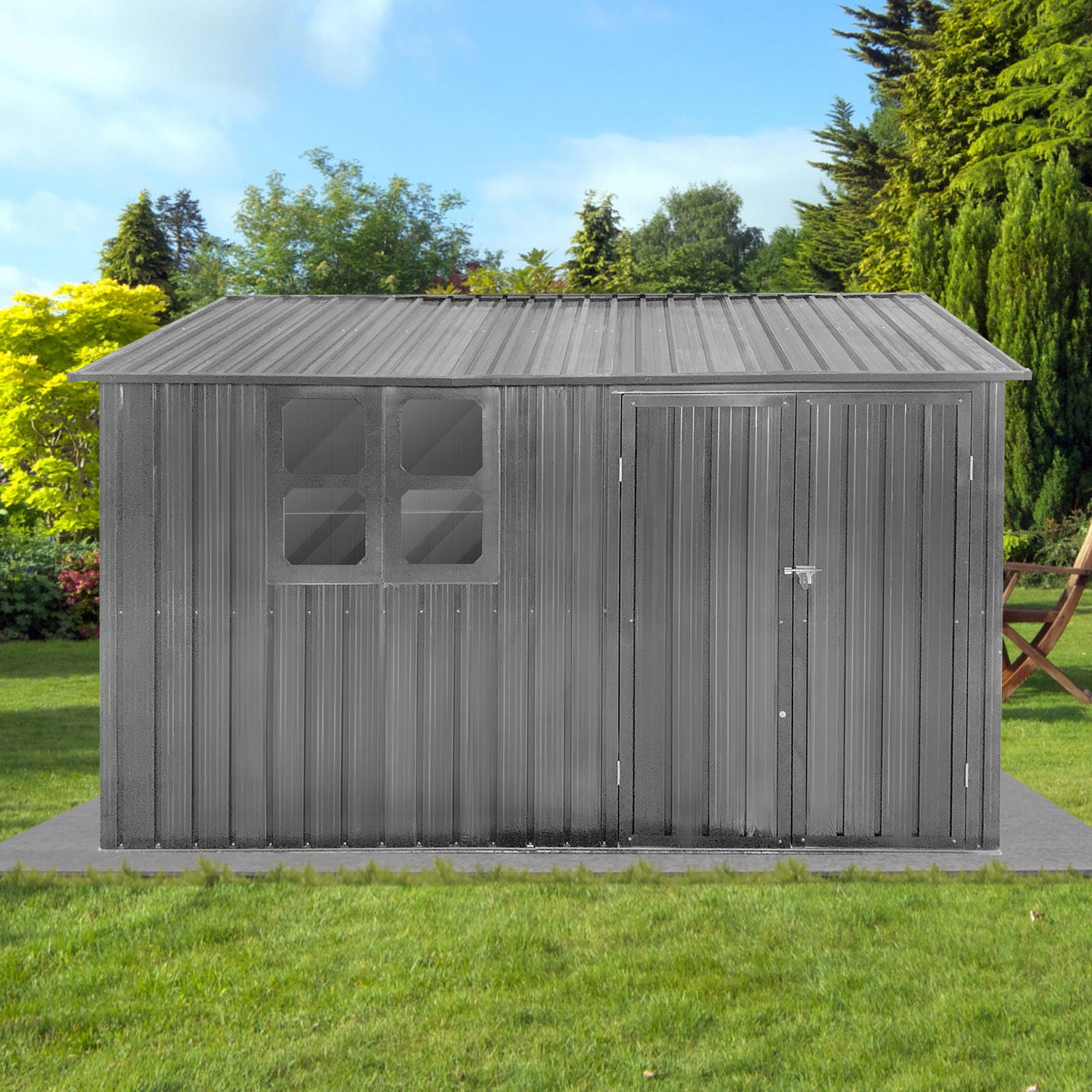 The 10' x 8' Garden Sheds Outdoor Storage Sheds With Window is a gray metal shed featuring a sloped roof, four left-side square windows, and a right-side door, standing on pavers in a grassy backyard with trees and outdoor furniture nearby.