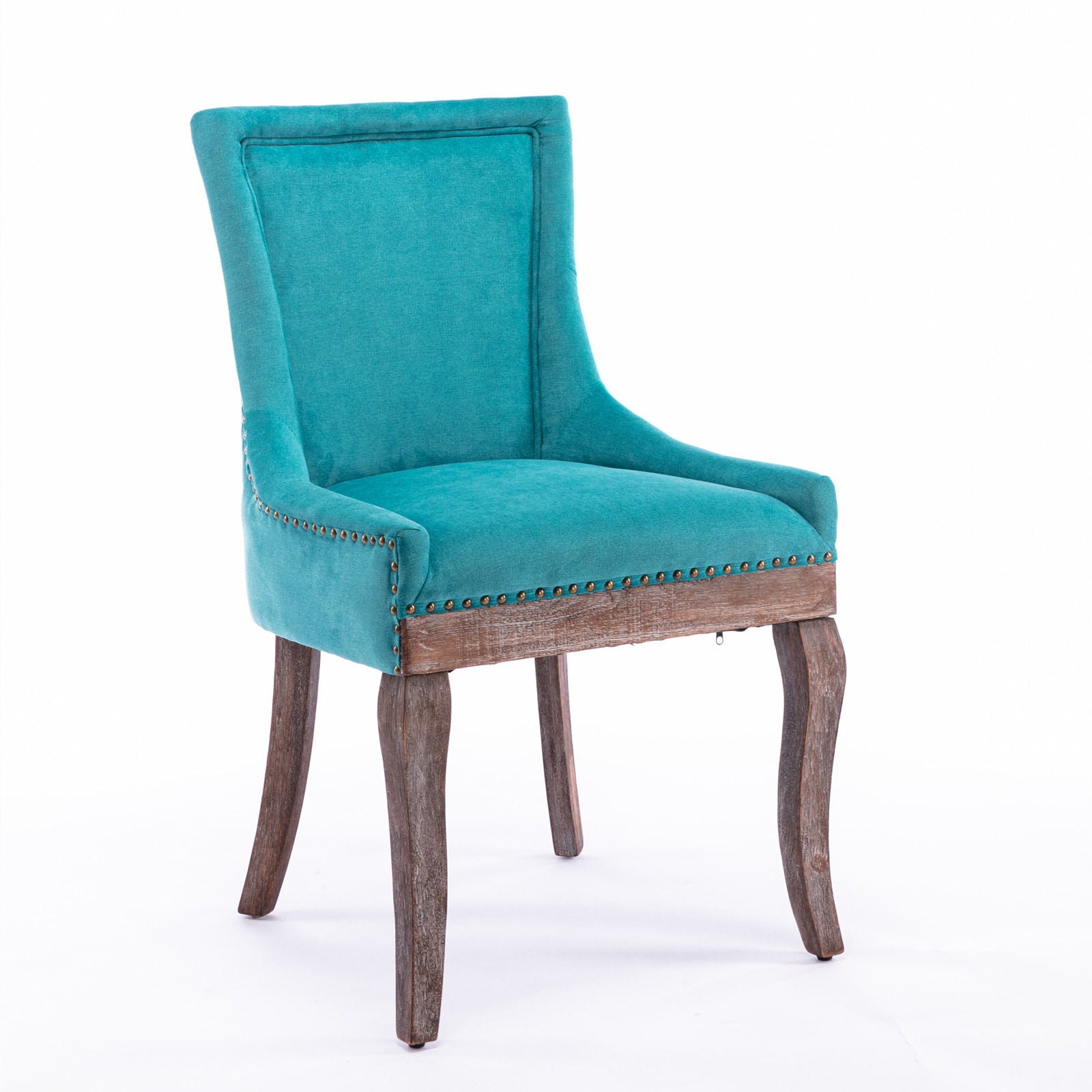 The Ultra Side Dining Chair set features thickened fabric upholstery in turquoise, bronze nailhead trim, and neutrally toned solid wood legs, shown against a plain white background.
