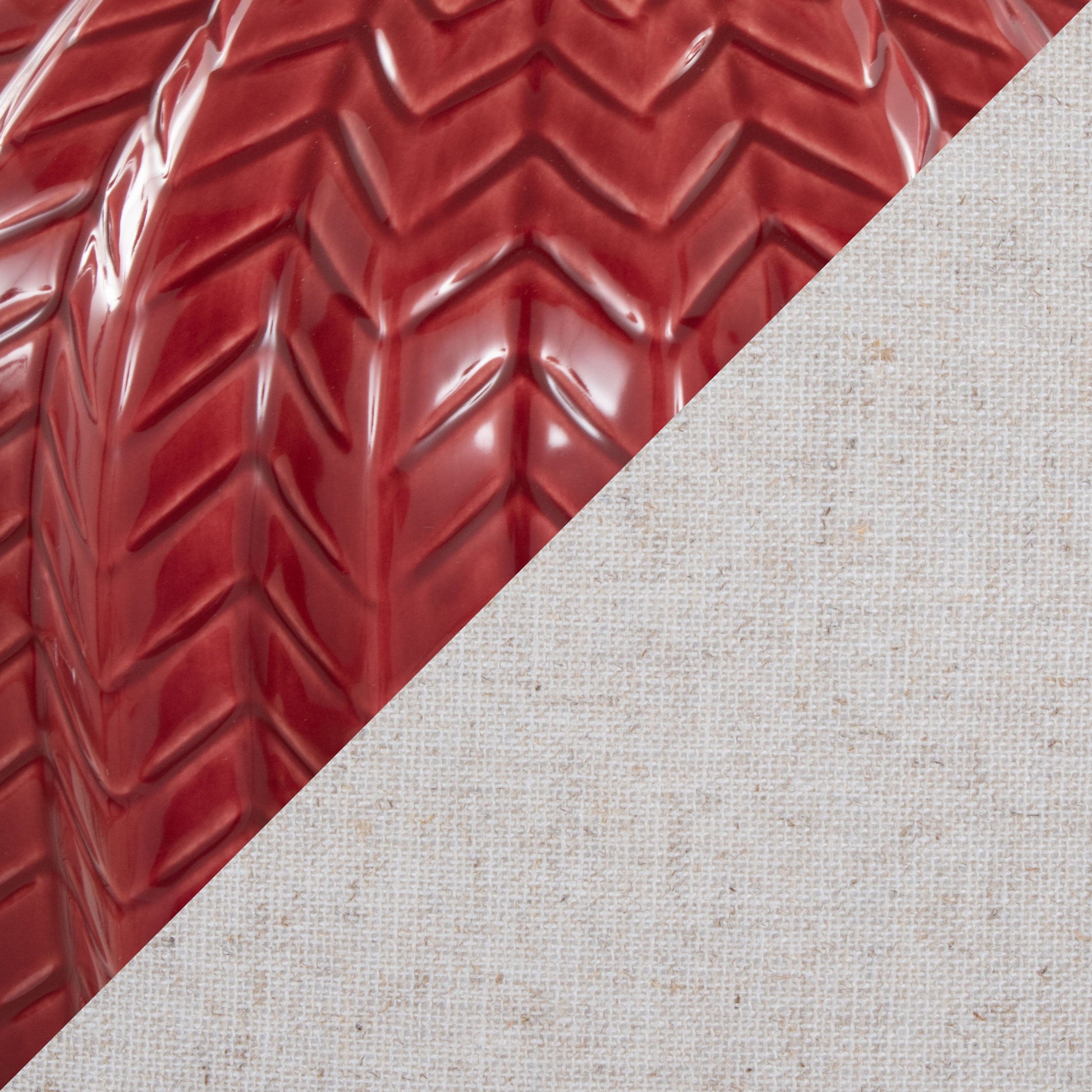 A diagonal split image features glossy red tire treads in the upper left and textured off-white linen fabric—reflecting the modern elegance of the Rockwell - Contemporary Table Lamp (Set of 2).