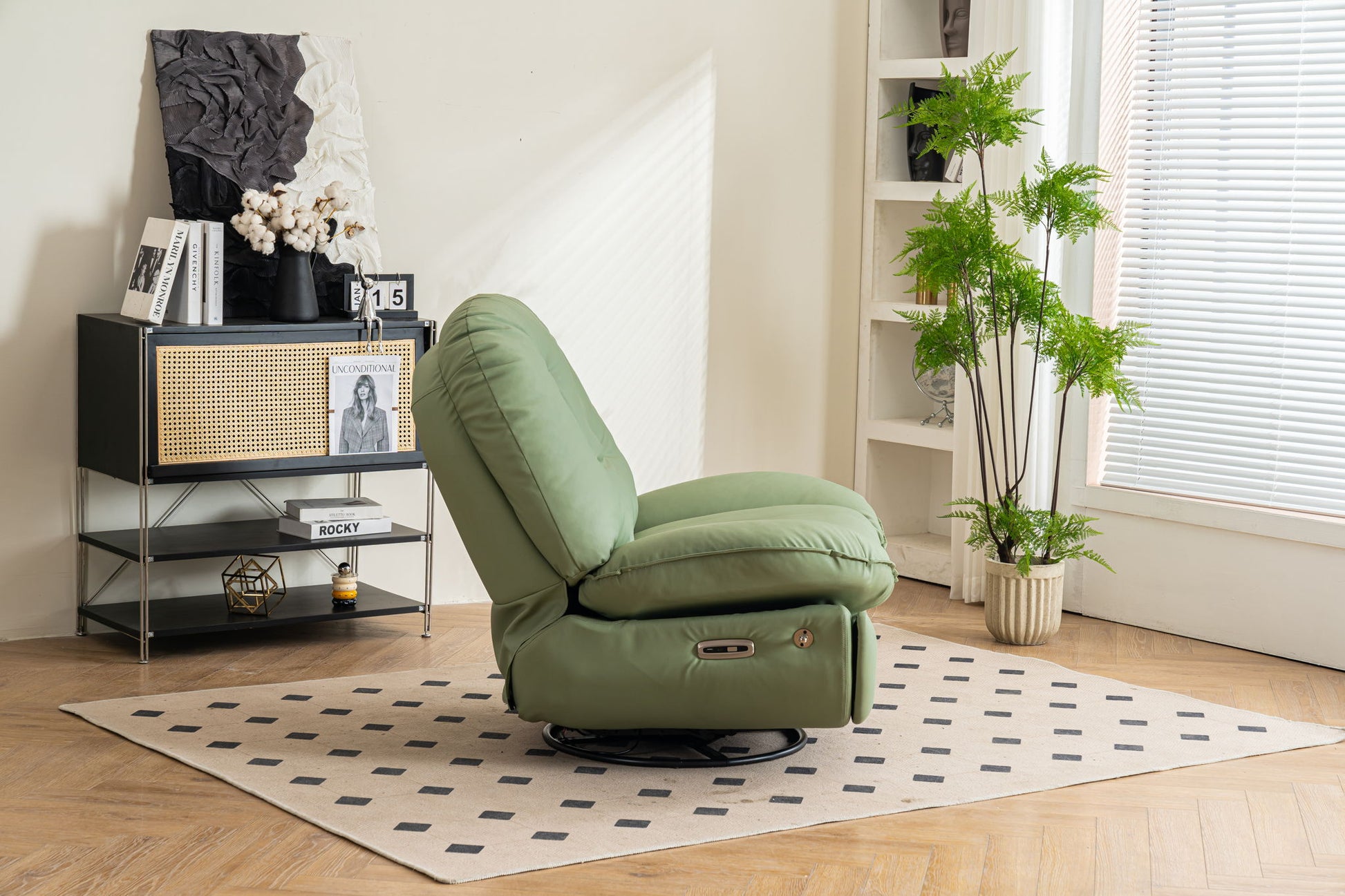 A modern living room showcases the Power Recliner Swivel Glider with USB Charger and Bluetooth Music Player on a beige rug, paired with a black rattan cabinet, decor accents, a potted plant, and sunlit window blinds.