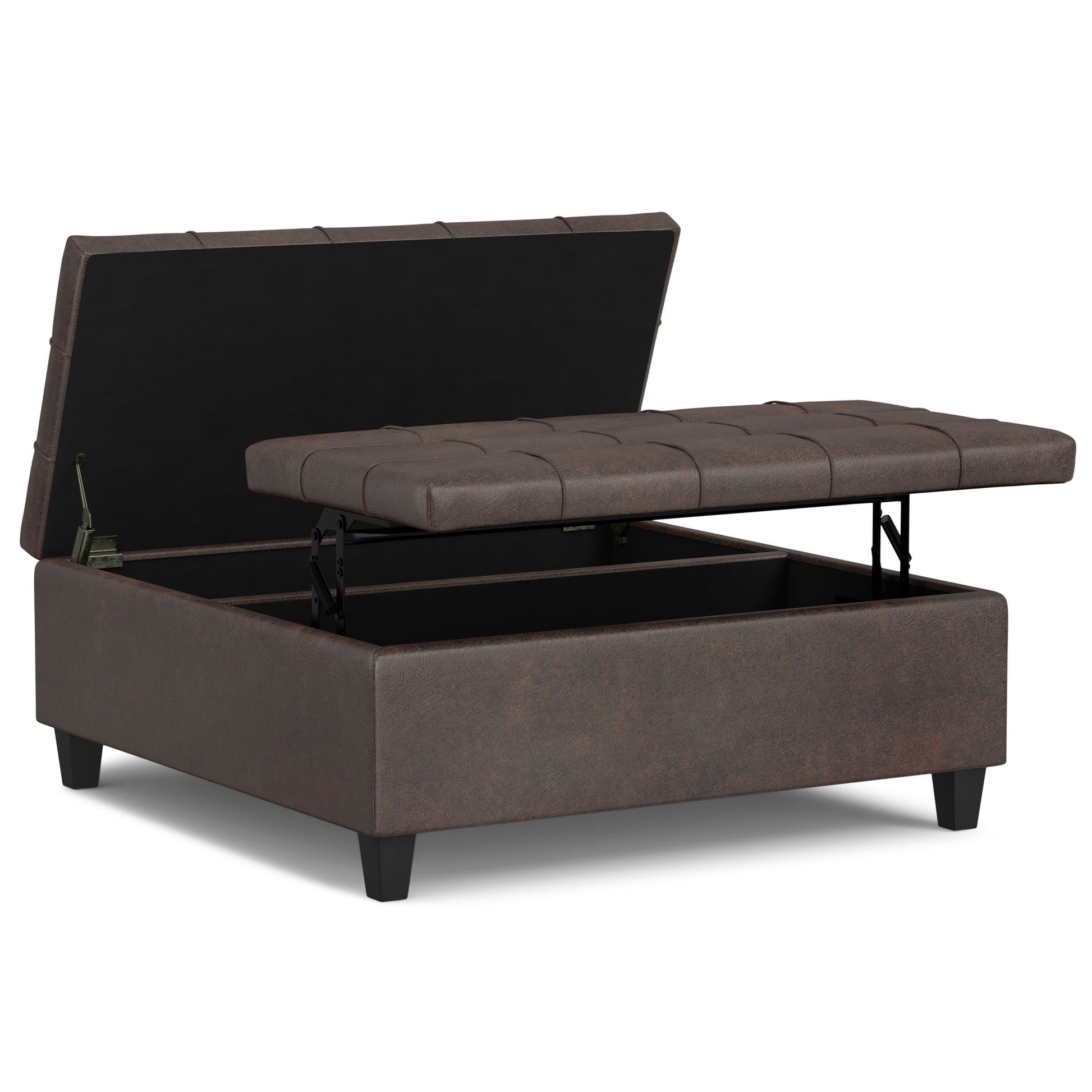The Harrison - Large Coffee Table Storage Ottoman features a brown tufted cushion, split-top hinged lid for easy access to storage space inside, and stands on four short legs.