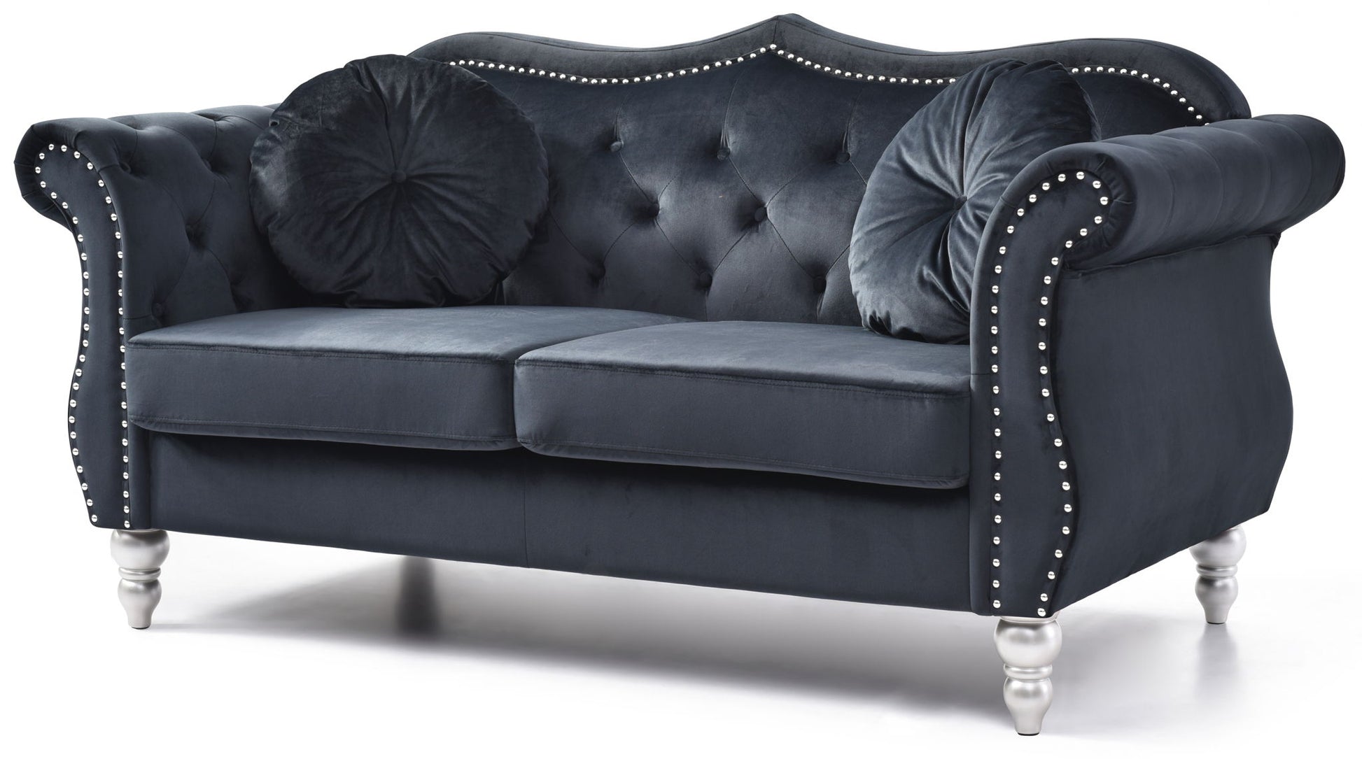 The Stylish Flared Arm Loveseat features a dark blue velvet finish, tufted back, silver stud accents, curved arms, two round pillows, and stands on four short silver legs.