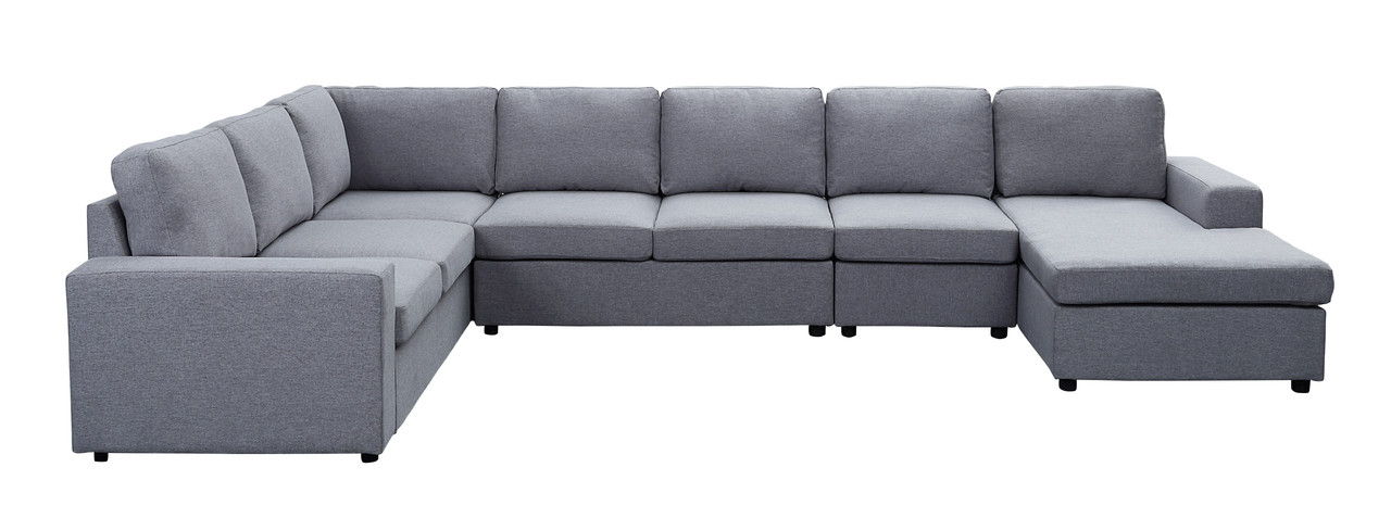 The Hayden - Linen 7 Seat Reversible Modular Sectional Sofa Chaise is a large, modern L-shaped gray sofa with plush back and seat cushions, featuring a reversible chaise and clean lines, shown against a white background.