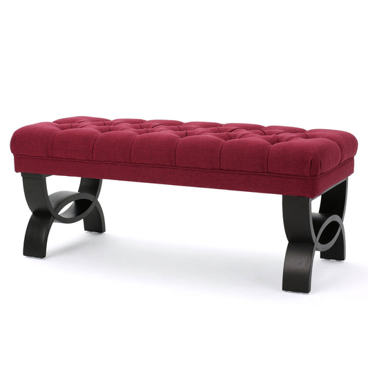 The Hilton - Ottoman Bench Classic Style features a rectangular tufted burgundy upholstered cushion and curved black wooden legs, shown against a white background.