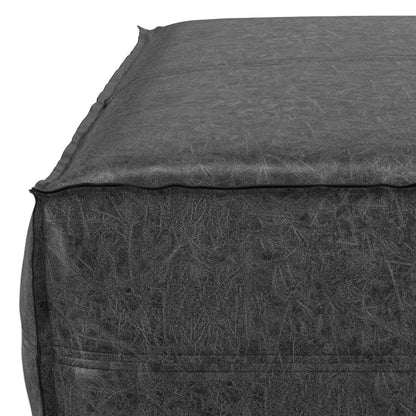 Close-up of the top corner of the Brody - Large Square, Coffee Table Pouf in dark gray, featuring detailed stitching and textured fabric along the seams.