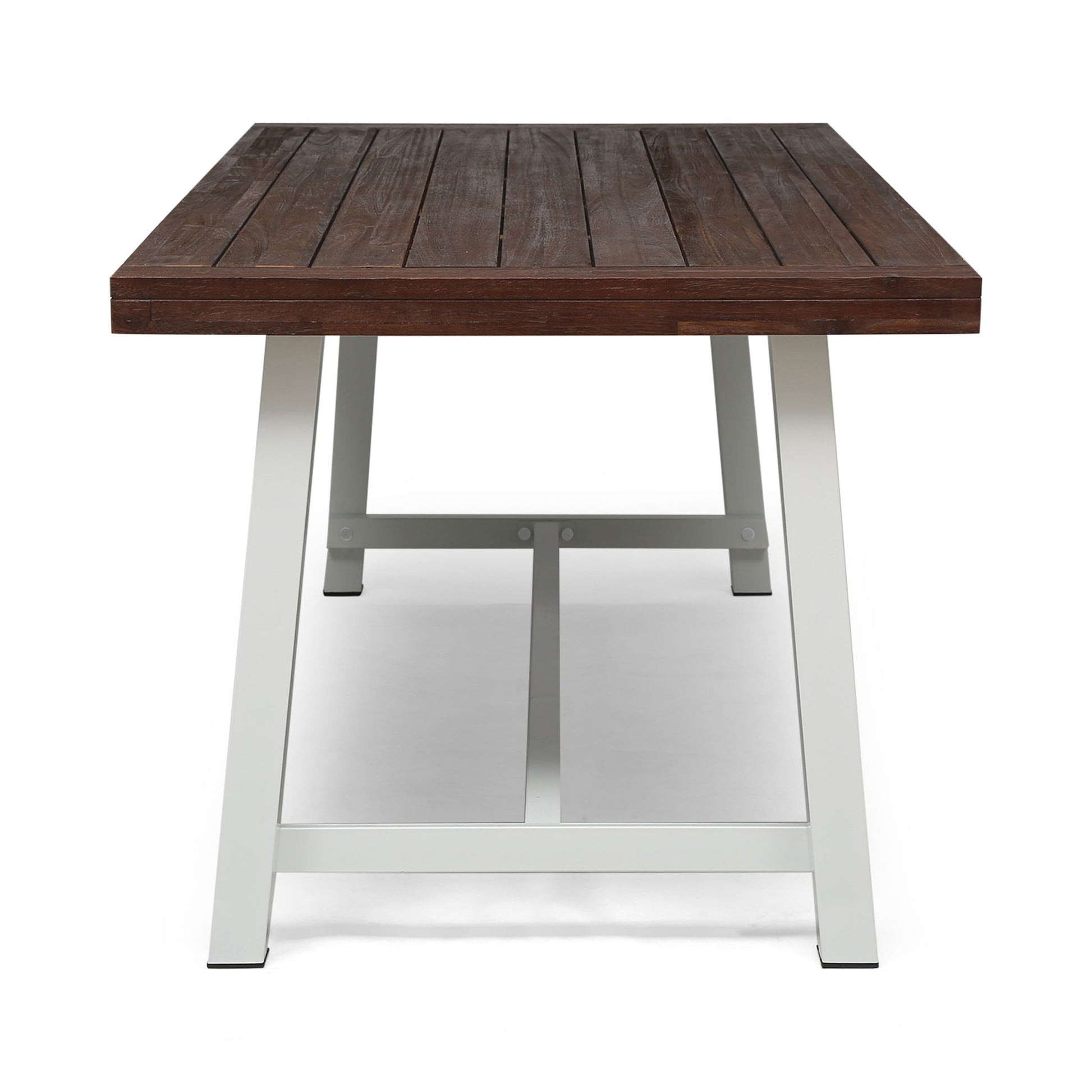 The Equilibrium Outdoor Dining Table features a dark brown slatted wooden top and white metal legs, shown from the end against a plain white background.