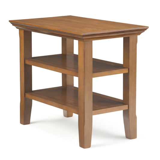 The Acadian - Narrow Side Table is handcrafted with a rectangular top, two lower shelves, four straight legs, a polished finish, and a simple, classic design.