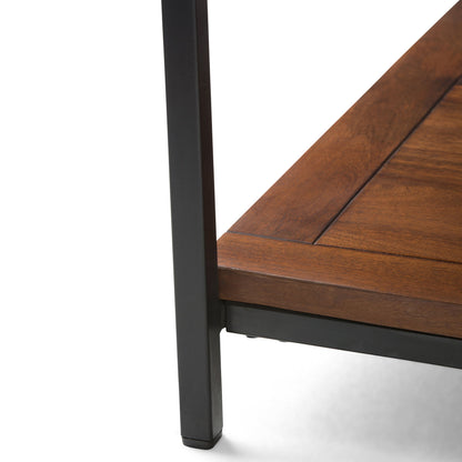 Close-up of the corner of the Skyler - Handcrafted Table featuring a dark brown wooden surface and black metal frame leg, shown against a white background.