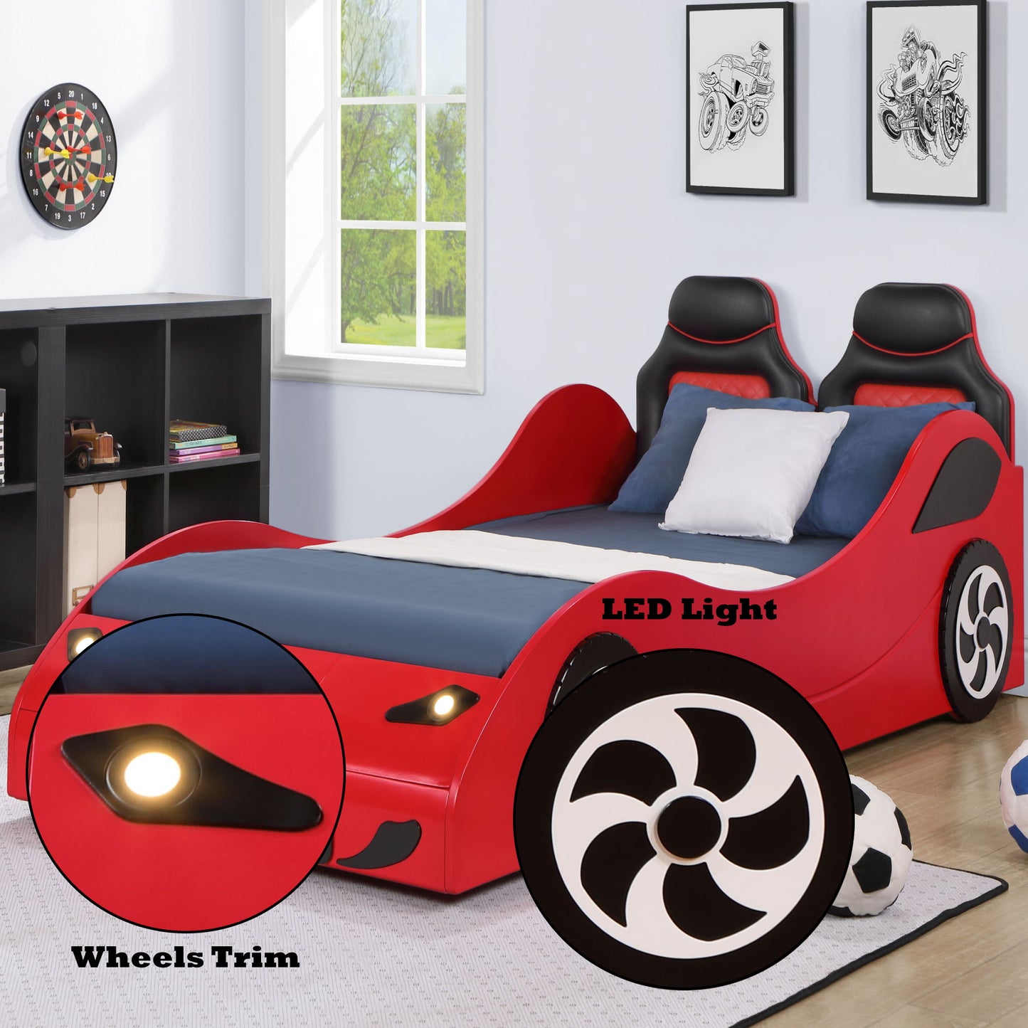 The Colen - Twin Car Bed With LED, featuring a red, car-inspired design with LED headlights and detailed wheel trims, is in a kid’s room decorated with sports decor, framed car art, toys, and a dartboard.
