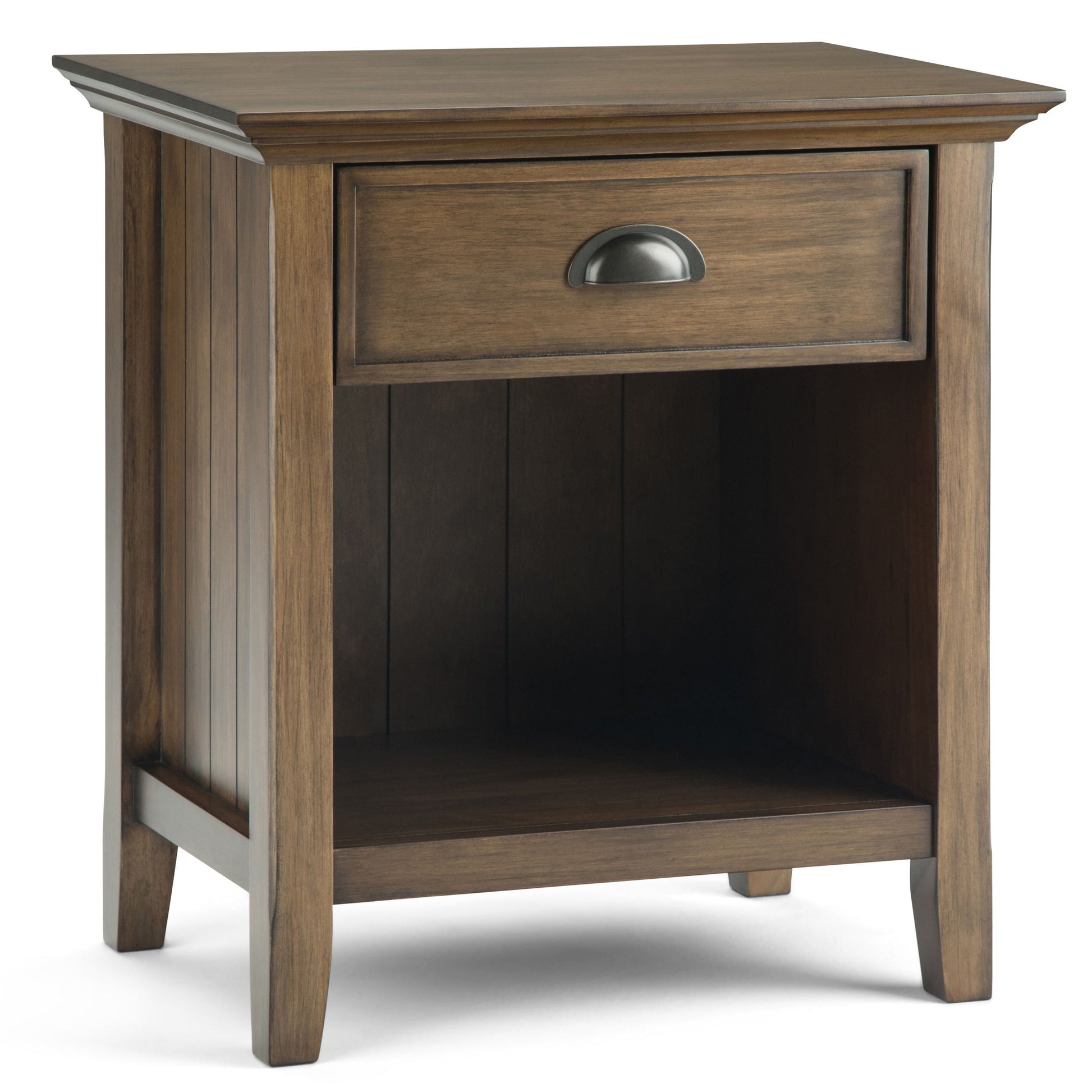 The Acadian Handcrafted Bedside Table is a wooden nightstand with a single drawer featuring a metal handle and an open lower shelf, displayed at an angle against a white background.