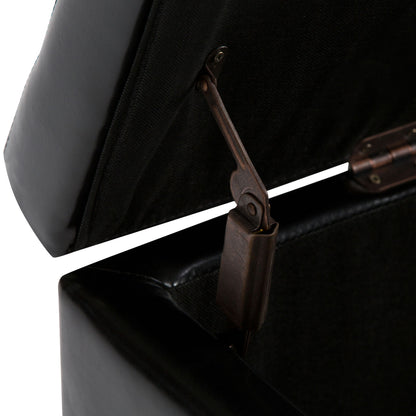 Close-up of the Hamilton - Upholstered Storage Ottoman with its black storage compartment open, highlighting the sturdy hinge mechanism and dark interior lining.