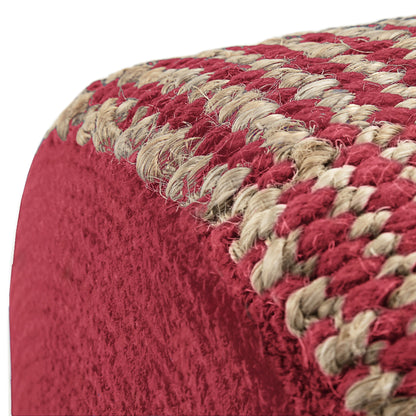 Close-up of the Larissa - Handcrafted Round Braided Pouf corner, highlighting its textured red fabric and woven beige and red trim with detailed stitching on a white background.