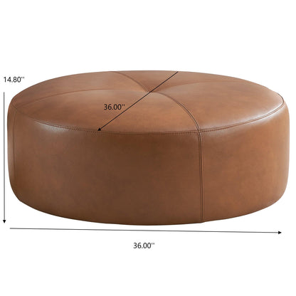 The Rochelin Ottoman in tan features smooth sides, stitched detailing on top, and a modern look. Measuring 36" in diameter and 14.8" high, this round leather ottoman is both stylish and functional for contemporary spaces.