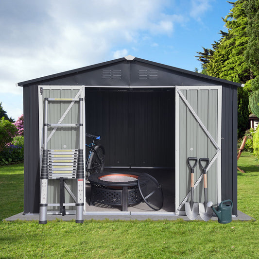 The 10'x12' Garden Sheds Outdoor Storage Sheds features open double doors, with a ladder, bicycle, fire pit, shovels, rake, and watering can arranged on the grass outside amid a green lawn and trees under a blue sky.